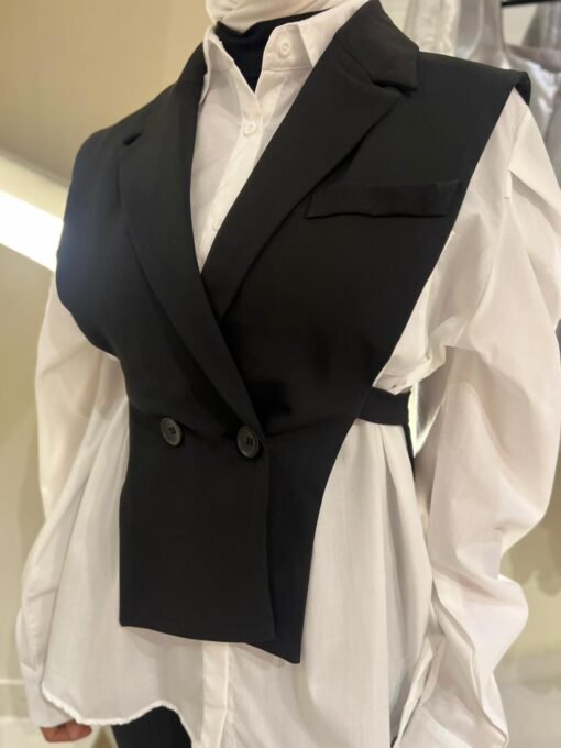 White shirt with black vest